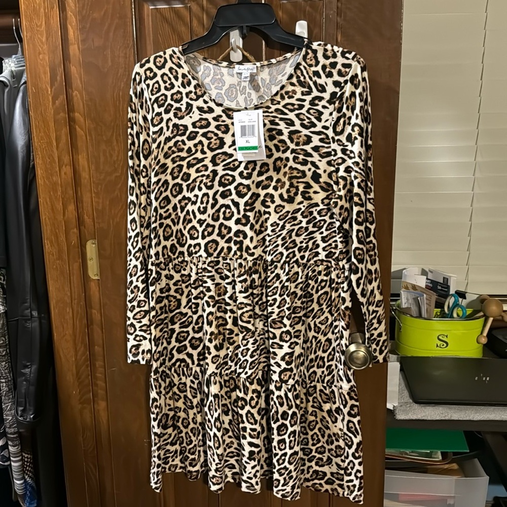 Beautiful Leopard print long sleeve dress. Never worn. Still with tags.